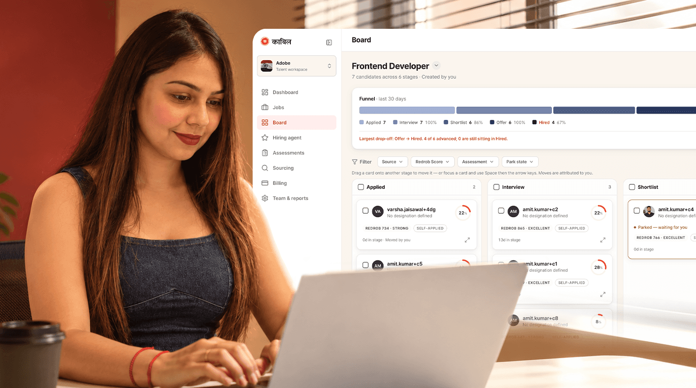 Recruiter reviewing a hiring board on a laptop